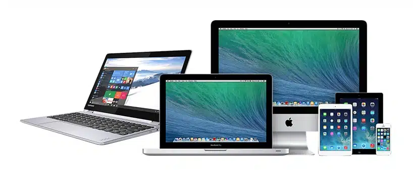 En række elektroniske enheder, herunder en bærbar computer med Windows OS, en macbook, en imac og flere modeller af iphone vist på en hvid baggrund.